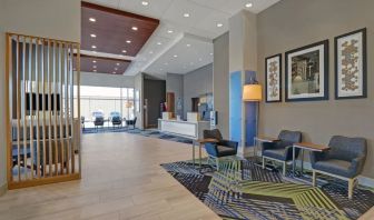 Hotel lobby with lounge area at Holiday Inn Express Kingston West.