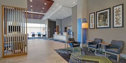 Hotel lobby with lounge area at Holiday Inn Express Kingston West.