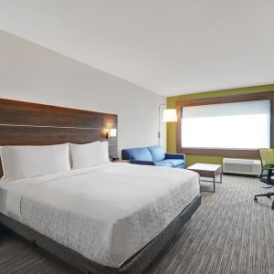 Day use room with TV, sofa, work desk and private bathroom at Holiday Inn Express Kingston West.