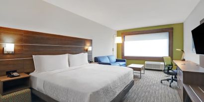 Day use room with TV, sofa, work desk and private bathroom at Holiday Inn Express Kingston West.