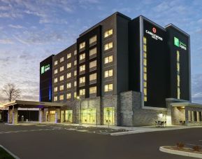 Hotel exterior and parking area at Holiday Inn Express Kingston West.