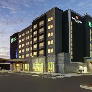 Hotel exterior and parking area at Holiday Inn Express Kingston West.