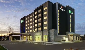 Hotel exterior and parking area at Holiday Inn Express Kingston West.