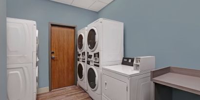 Laundry room at Holiday Inn Express Kingston West.