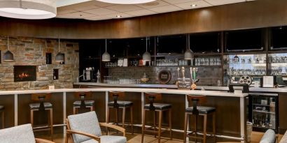 Hotel bar with lounge area at Four Points By Sheraton Toronto Mississauga.