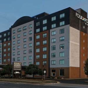 Hotel exterior and parking area at Four Points By Sheraton Toronto Mississauga.