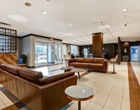 Hotel lobby with lounge seating at Four Points By Sheraton Toronto Mississauga.