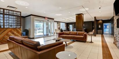 Hotel lobby with lounge seating at Four Points By Sheraton Toronto Mississauga.