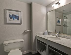 Private guest bathroom with shower and free toiletries at Four Points By Sheraton Toronto Mississauga.