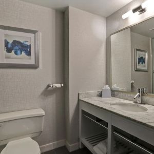 Private guest bathroom with shower and free toiletries at Four Points By Sheraton Toronto Mississauga.