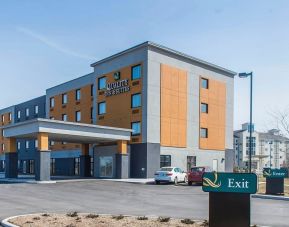 Hotel exterior with parking area at Quality Inn & Suites Kingston.