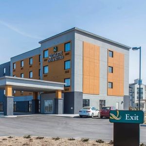 Hotel exterior with parking area at Quality Inn & Suites Kingston.