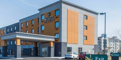 Hotel exterior with parking area at Quality Inn & Suites Kingston.