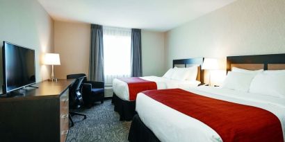 Day use twin room with TV, work desk and private bathroom at Quality Inn & Suites Kingston.