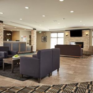 Hotel lobby with lounge area at Quality Inn & Suites Kingston.