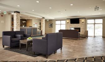 Hotel lobby with lounge area at Quality Inn & Suites Kingston.