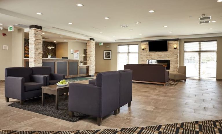 Hotel lobby with lounge area at Quality Inn & Suites Kingston.