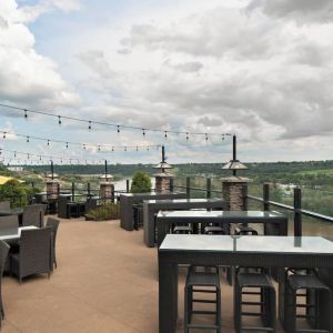 Hotel terrace with beautiful view and comfortable seating at Courtyard By Marriott Edmonton Downtown.