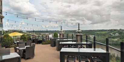 Hotel terrace with beautiful view and comfortable seating at Courtyard By Marriott Edmonton Downtown.