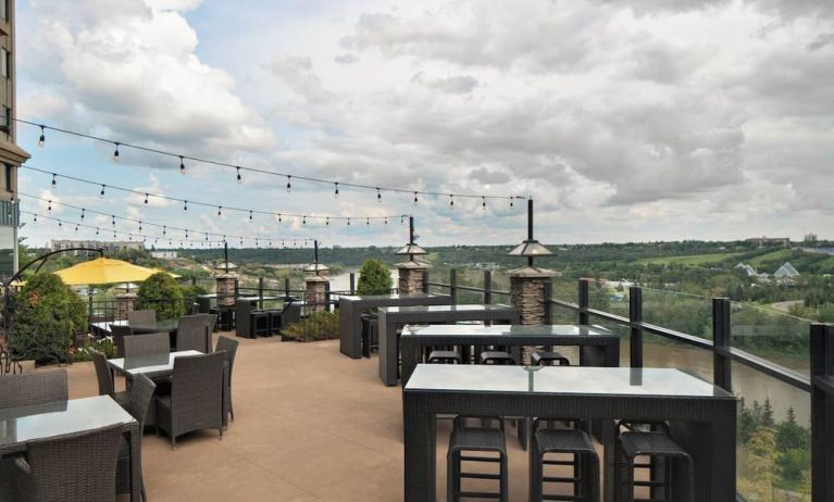 Hotel terrace with beautiful view and comfortable seating at Courtyard By Marriott Edmonton Downtown.