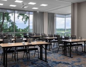 Professional meeting room with large windows at Courtyard By Marriott Edmonton Downtown.