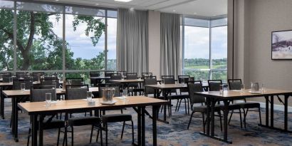 Professional meeting room with large windows at Courtyard By Marriott Edmonton Downtown.