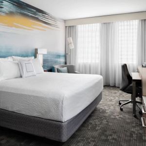 Day use room with TV, work desk and private bathroom at Courtyard By Marriott Edmonton Downtown.