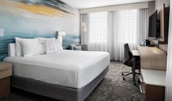 Day use room with TV, work desk and private bathroom at Courtyard By Marriott Edmonton Downtown.