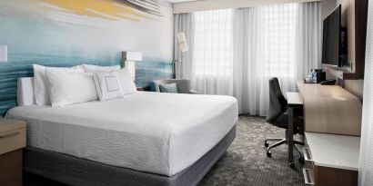 Day use room with TV, work desk and private bathroom at Courtyard By Marriott Edmonton Downtown.