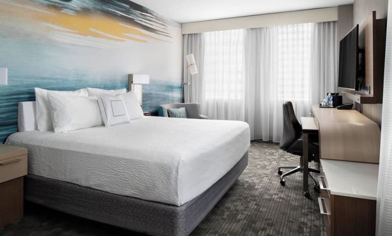 Day use room with TV, work desk and private bathroom at Courtyard By Marriott Edmonton Downtown.