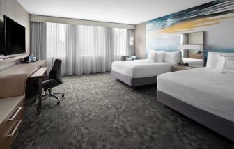 Day use twin room with TV, work desk and private bathroom at Courtyard By Marriott Edmonton Downtown.