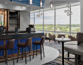 Hotel bar with lounge area at Courtyard By Marriott Edmonton Downtown.