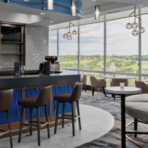 Hotel bar with lounge area at Courtyard By Marriott Edmonton Downtown.