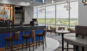 Hotel bar with lounge area at Courtyard By Marriott Edmonton Downtown.