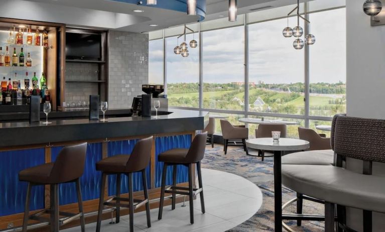 Hotel bar with lounge area at Courtyard By Marriott Edmonton Downtown.