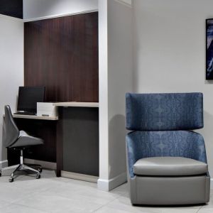 Business center with computer, printer and ergonomic chair at Courtyard By Marriott Edmonton Downtown.