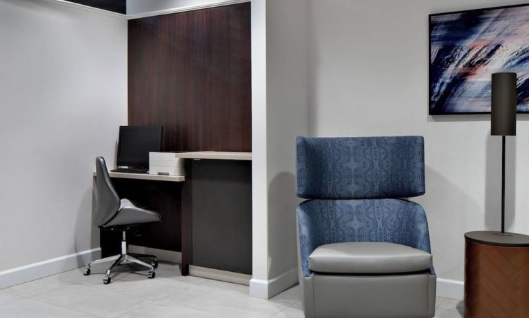 Business center with computer, printer and ergonomic chair at Courtyard By Marriott Edmonton Downtown.