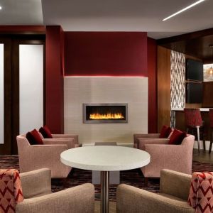 Hotel bar comfortable lounge area with fireplace at DoubleTree By Hilton Hotel Toronto Airport West.