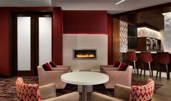 Hotel bar comfortable lounge area with fireplace at DoubleTree By Hilton Hotel Toronto Airport West.