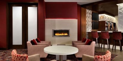 Hotel bar comfortable lounge area with fireplace at DoubleTree By Hilton Hotel Toronto Airport West.