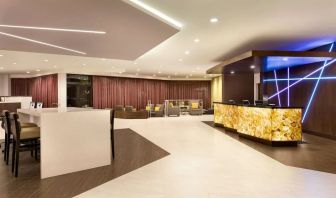 Hotel lobby with lounge area and work space at DoubleTree By Hilton Hotel Toronto Airport West.
