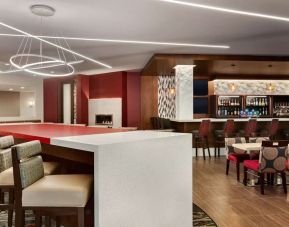 Stylish hotel bar with comfortable seating at DoubleTree By Hilton Hotel Toronto Airport West.