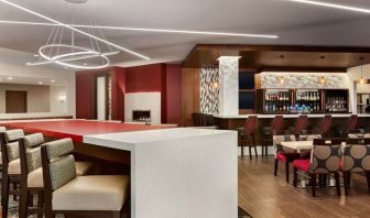 Stylish hotel bar with comfortable seating at DoubleTree By Hilton Hotel Toronto Airport West.