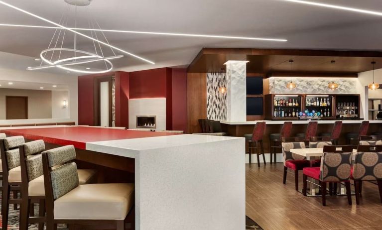 Stylish hotel bar with comfortable seating at DoubleTree By Hilton Hotel Toronto Airport West.