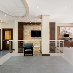 Hotel lobby with lounge area and workspace at La Quinta Inn & Suites By Wyndham Oshawa.