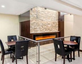 Dining area with fireplace at La Quinta Inn & Suites By Wyndham Oshawa.