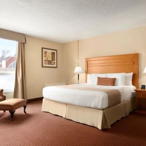 Day use room with TV, sofa, work desk and private bathroom at Days Inn Edmonton Downtown.