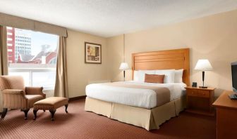 Day use room with TV, sofa, work desk and private bathroom at Days Inn Edmonton Downtown.