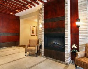 Lobby lounge area with fireplace at Days Inn Edmonton Downtown.