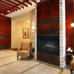 Lobby lounge area with fireplace at Days Inn Edmonton Downtown.